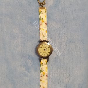 Montre bracelet en tissu jaune fleuri