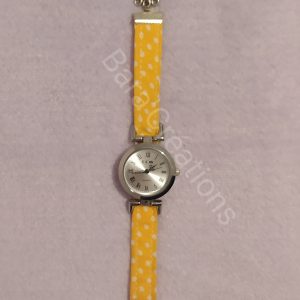 Montre bracelet en tissu jaune à pois blancs